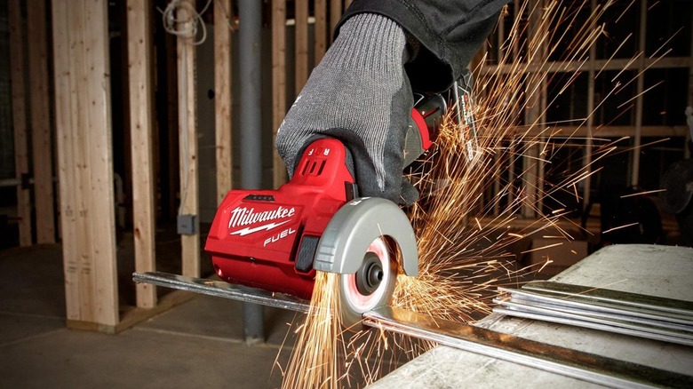 Using a Milwaukee saw on metal rods with sparks produced in the process.