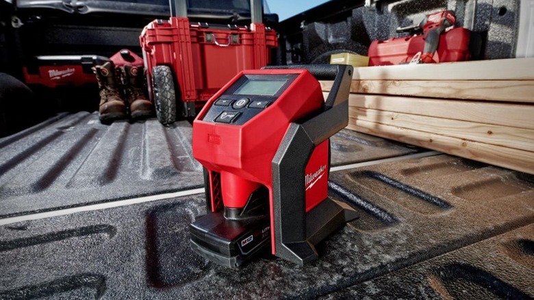 A portable inflator along with a rolling tool box and other products placed in the deck of a car.
