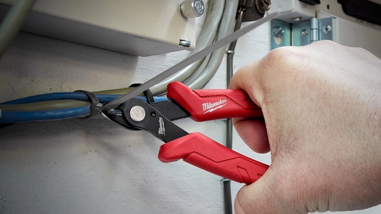 Cutting wire insulations with Milwaukee pliers.