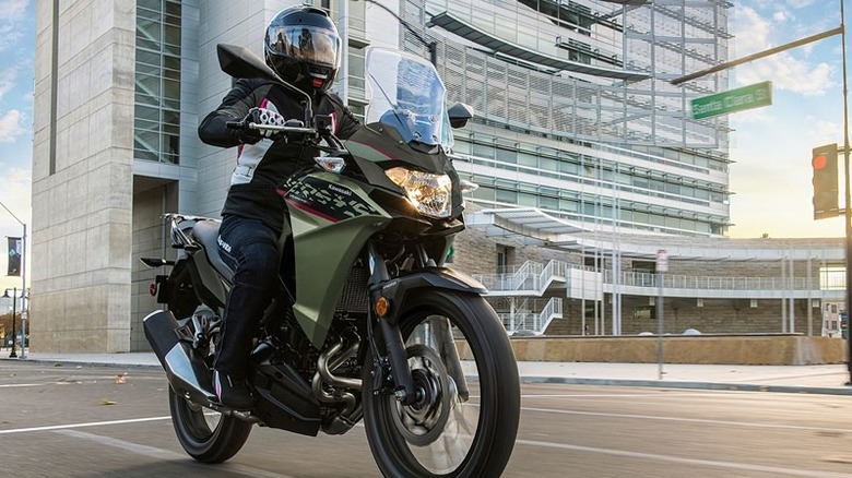 A Kawasaki Versys-X 300 being ridden in the city