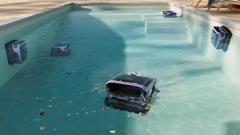 Five Beatbot Sora 70 pool robots cleaning different parts of a swimming pool.