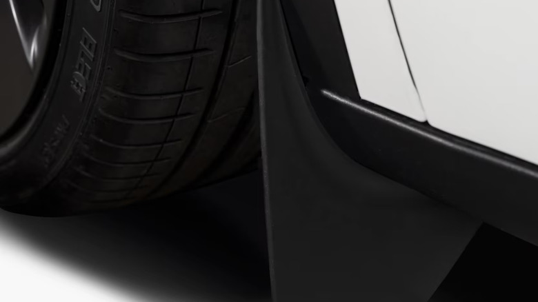 The official Tesla mudflaps installed on the Model Y