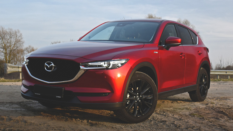 Red CX-5 in the dirt