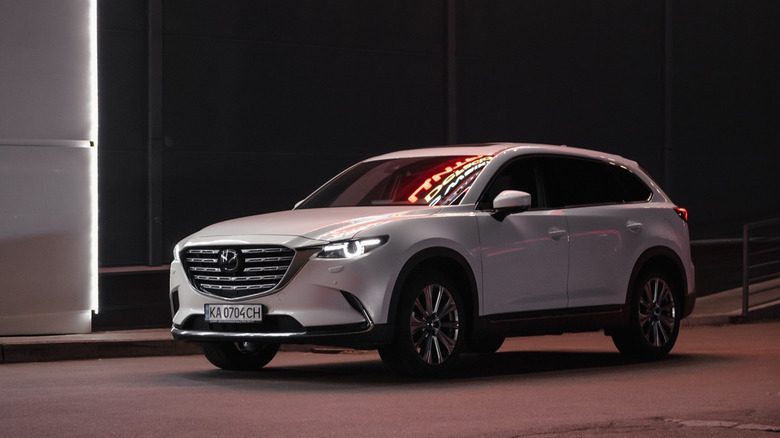 white CX-9 on the city streets