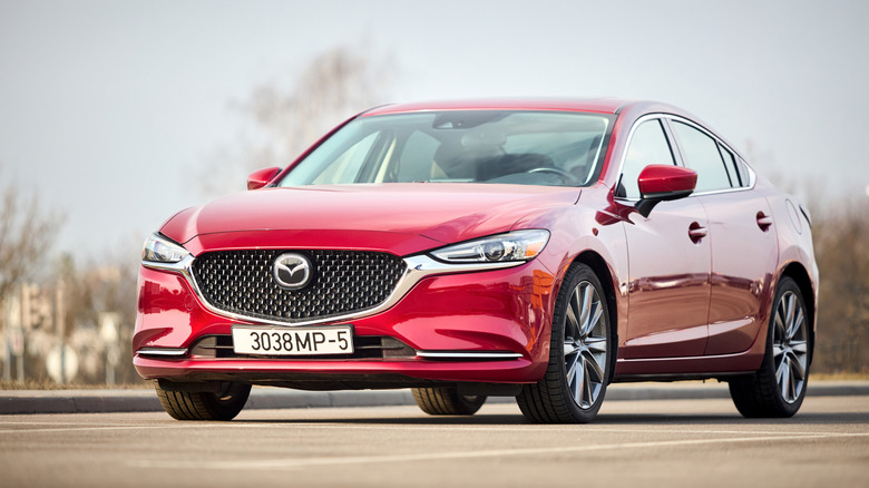 red Mazda 6 in a lot
