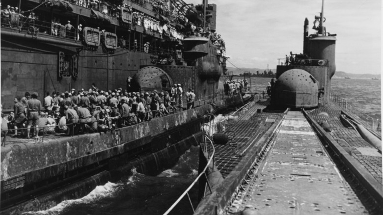I 400 submarine parked next to surface ship