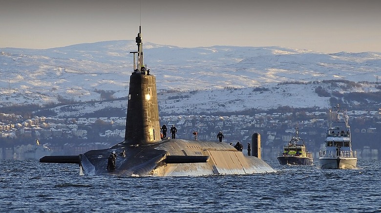 Vanguard class submarine surfaced in front of snowy hills