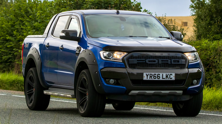 A Ford Pickup Truck travelling on a road