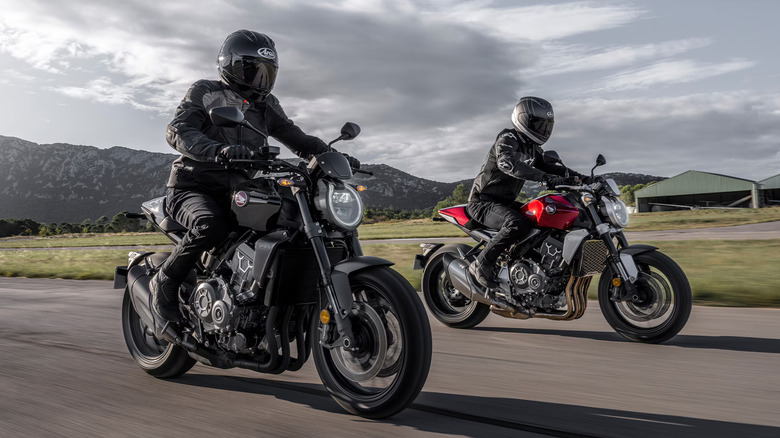 Two Honda CB1000R motorcycles on the road