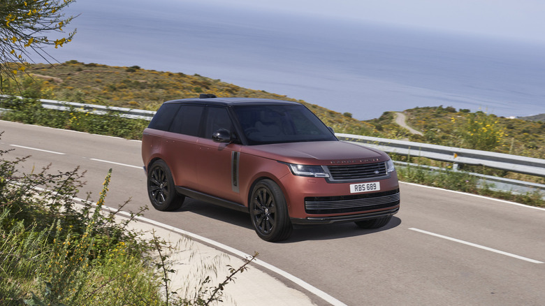 Range Rover driving on a road