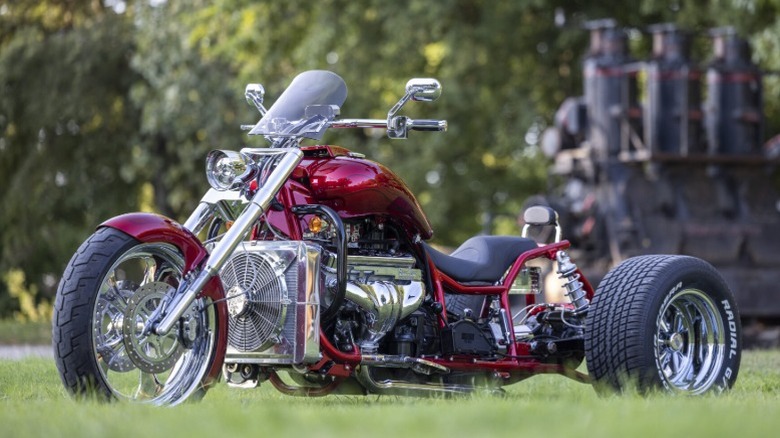 Red Boss Hoss Dragon parked on grass
