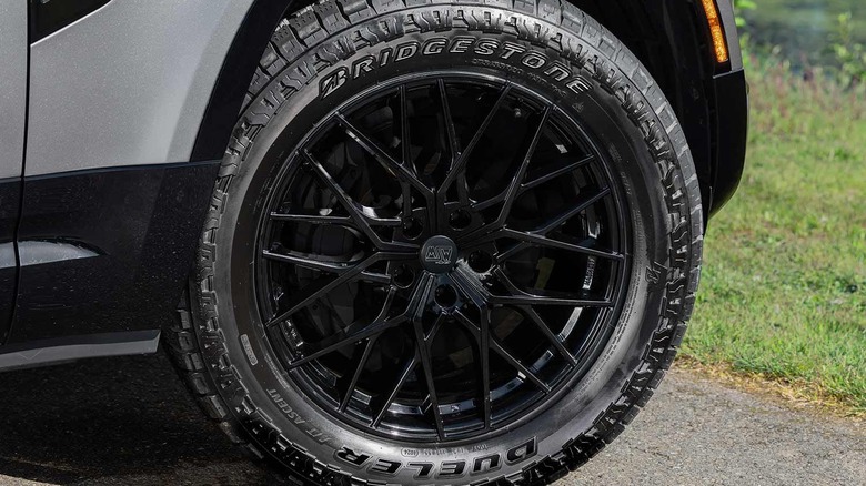Close-up of a Bridgestone Dueler A/T Ascent tire, attached to a vehicle