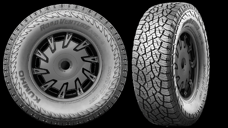 The Kumho Road Venture AT52 tires on a black background