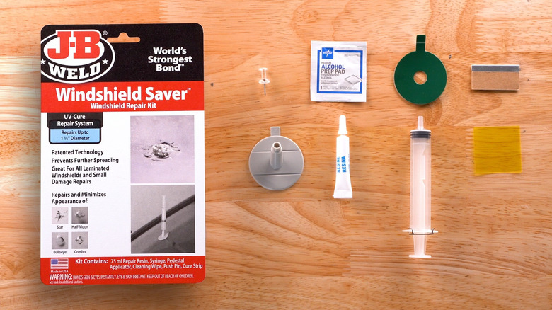 A windshield repair kit's components on a table