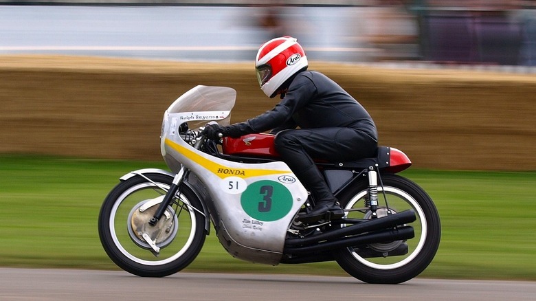 Classic Honda RC166 racing motorcycle on race track