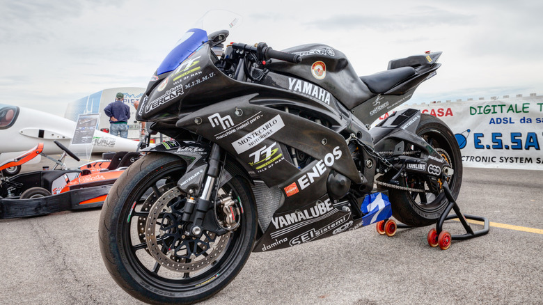 Yamaha R6 race bike on wheel stand in pit at race.