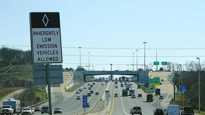 Inherently low emission vehicle sign