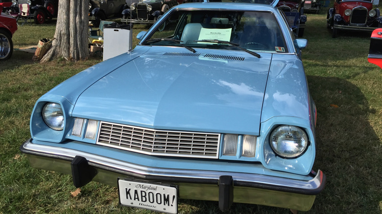Blue 1977-78 Ford Pinto Runabout with ironic "Kaboom" license plate seen from in front