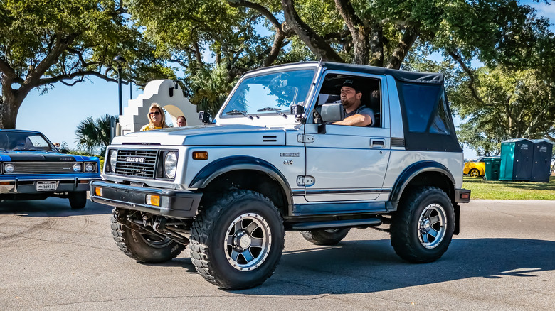 Silver 1988 Suzuki Samurai seen from left front at car show