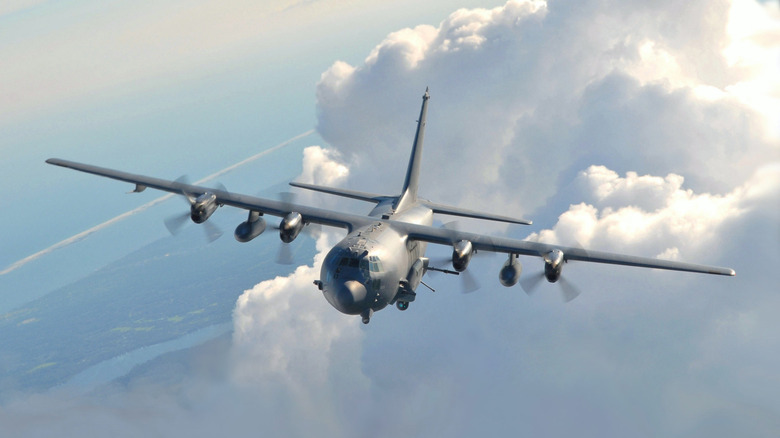 AC-130 flying among clouds