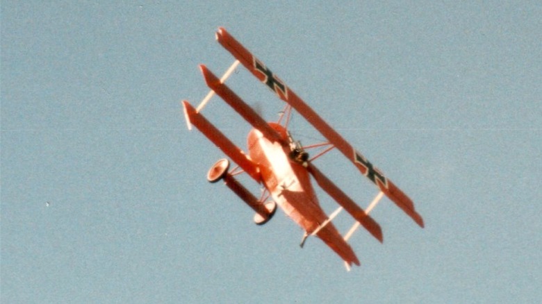 Fokker Dr. I replica in flight at a Shoreham airshow