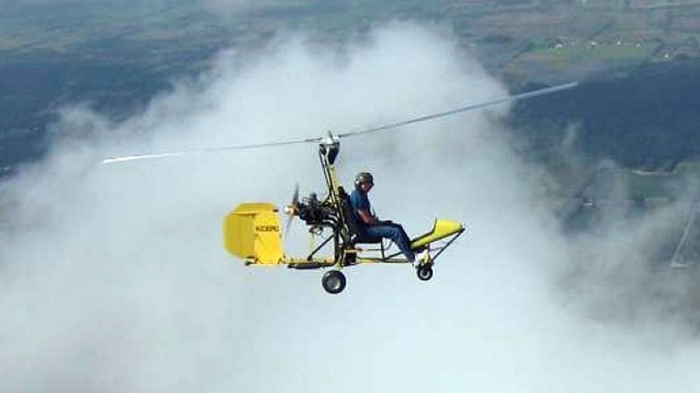 Benson B-8 gyrocopter in the skyamong the clouds