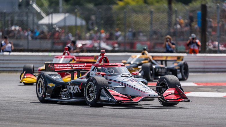 IndyCar racing around a curve