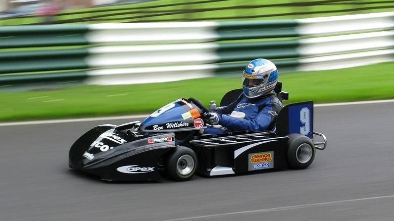 Professional kart racing around a track