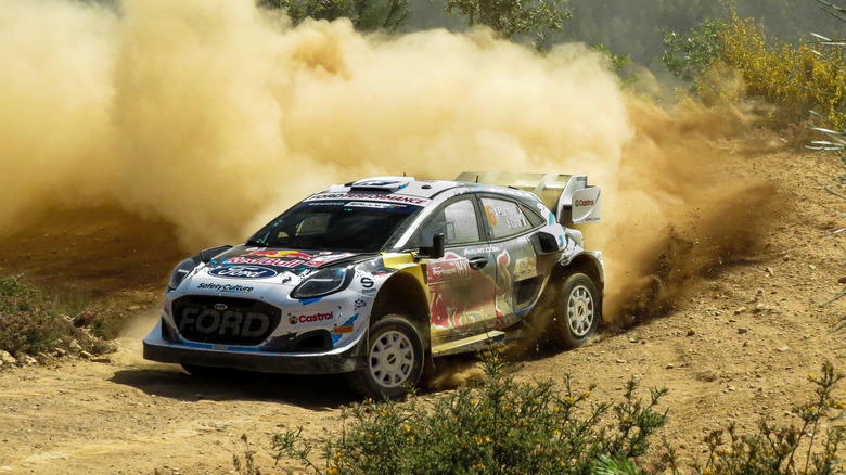 World rally car racer taking a turn