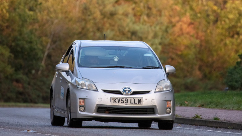 Silver Toyota Prius on road