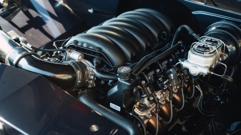 A close up view of the General Motors 6.6-liter V8 crate engine, pictured here in an engine bay of an unknown vehicle.