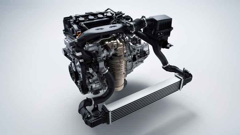 Honda's 1.5-liter L15CA engine used in the Civic 10th-generation onwards, pictured here against a slate gray background.
