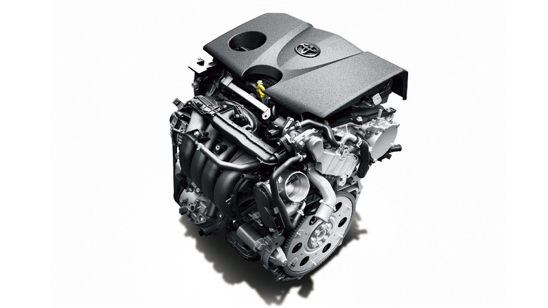 A 2.0-liter Toyota M20A-FKS four-cylinder engine placed at an angle to us on a white background in a studio.