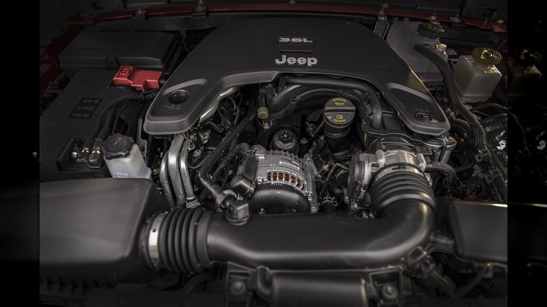 A clear view of the 3.6L Pentastar V6 engine beneath the hood of a vehicle.