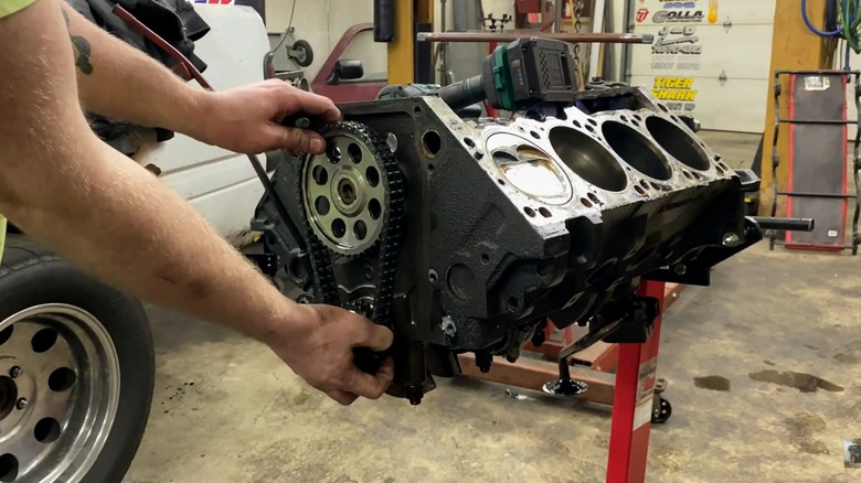 A clear view of the 5.9L Magnum V8 positioned at the center of the workshop while it undergoes maintenance.