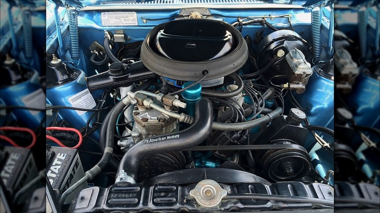 A clear view of the AMC 401 V8 engine beneath the hood of a vehicle.