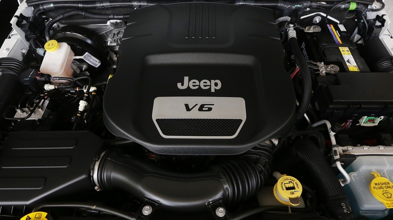 A clear view of the 3.6L Pentastar V6 engine beneath the hood of a vehicle.