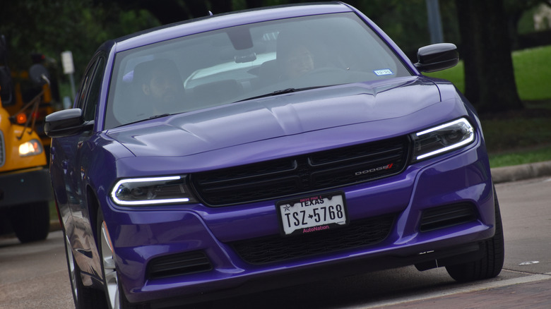 Purple dodge charger on street