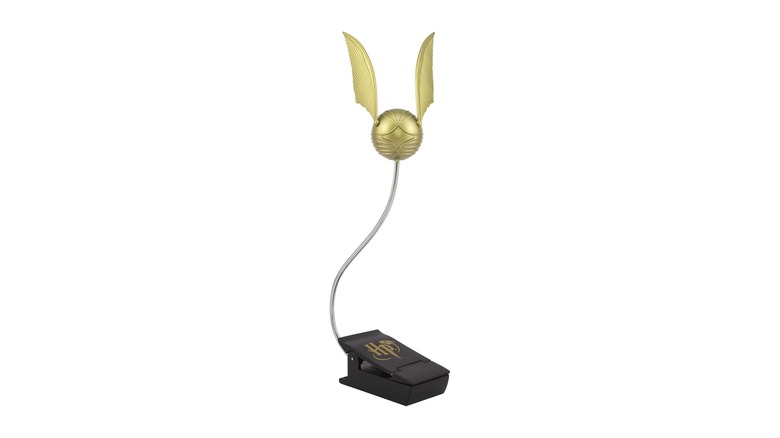 Golden ball with wings attached to a clip
