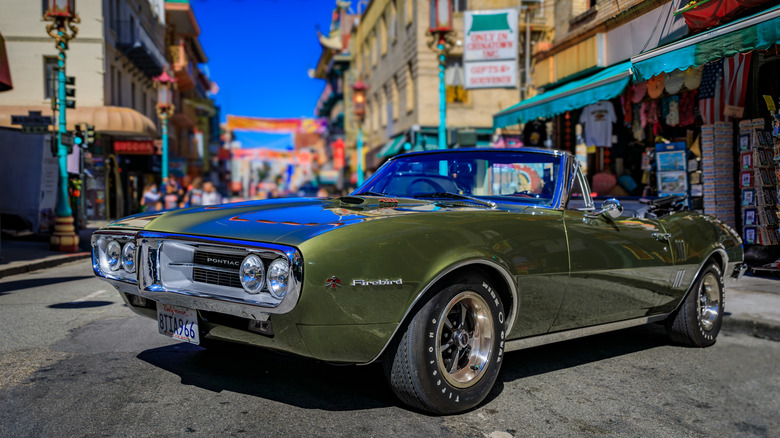 A green Pontiac Firebird convertible
