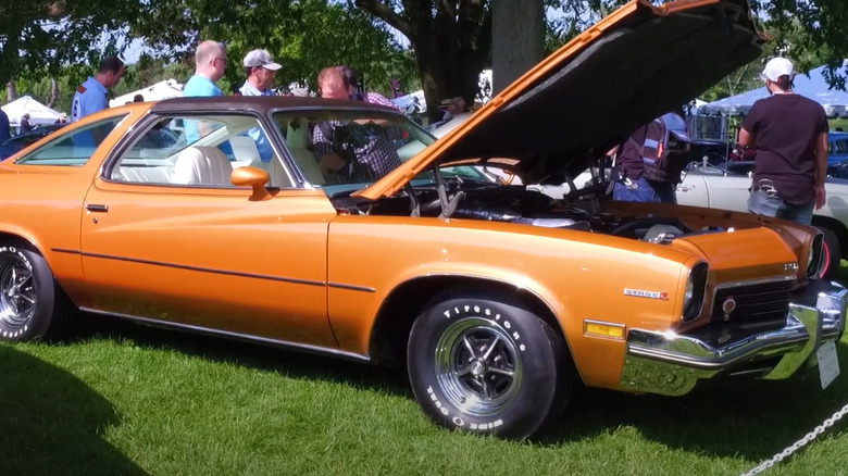 A bright yellow Buick Sun Coupe being displayed outdoors at the 2020 Greenwich Concours D'Elegance