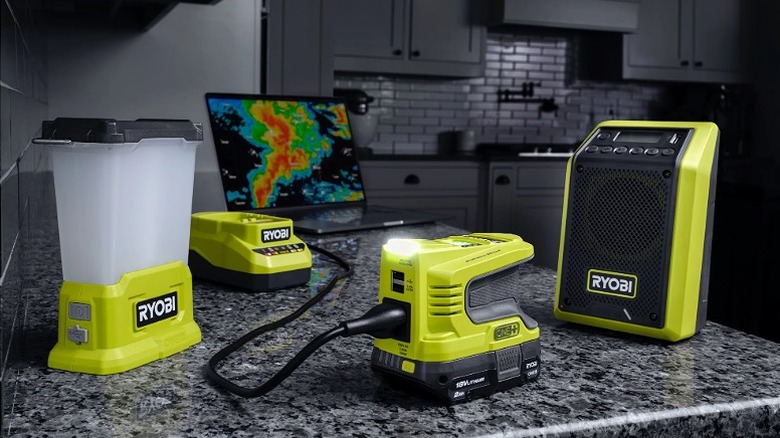 Multiple Ryobi tools placed on a kitchen counter during a power breakdown