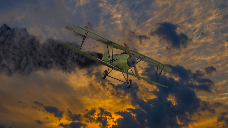 historic propeller biplane in sky