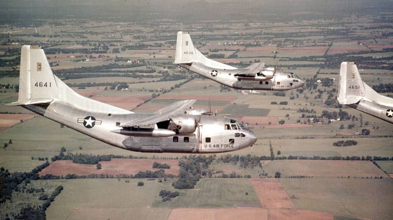 Three Fairchild C-123B planes in flight
