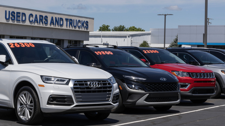 lineup of used vehicles at a dealership