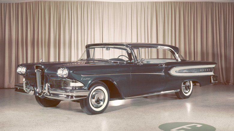 Blue 1958 Edsel Citation Tudor Hardtop seen from left front on display on a curtained stage