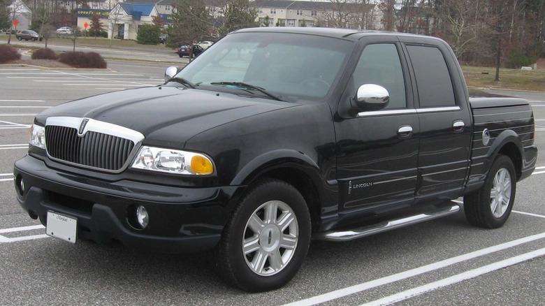 Black 2002 Lincoln Blackwood pickup truck seen from front left in a parking lot