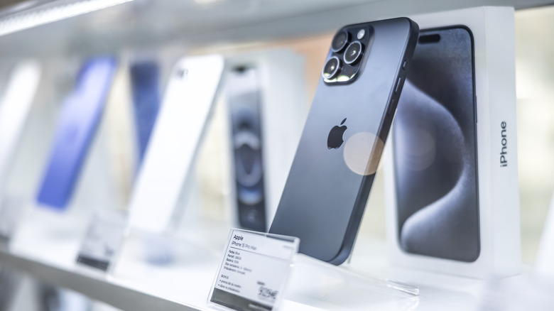 Apple iPhones on a shelf in a store
