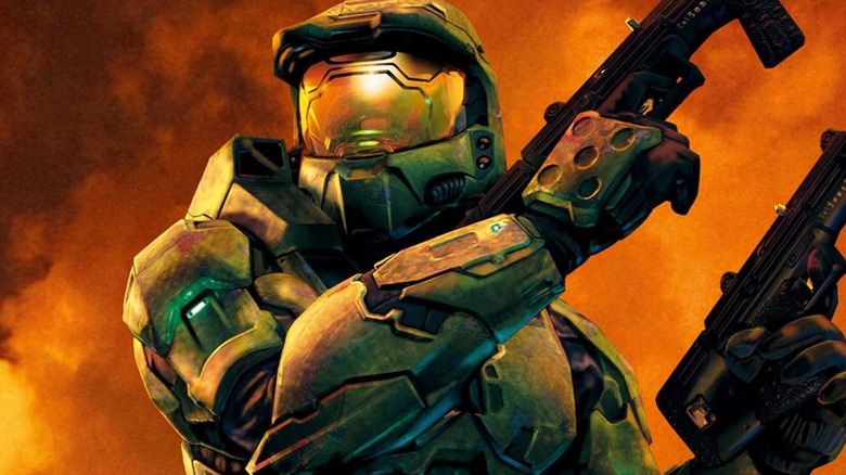 Master Chief holding two SMGs