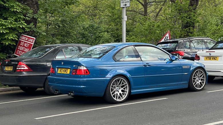 Blue E46 BMW rear three-quarter view in traffic